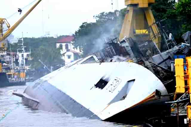 Indian Navy's INS Brahmaputra listed to its port side. 